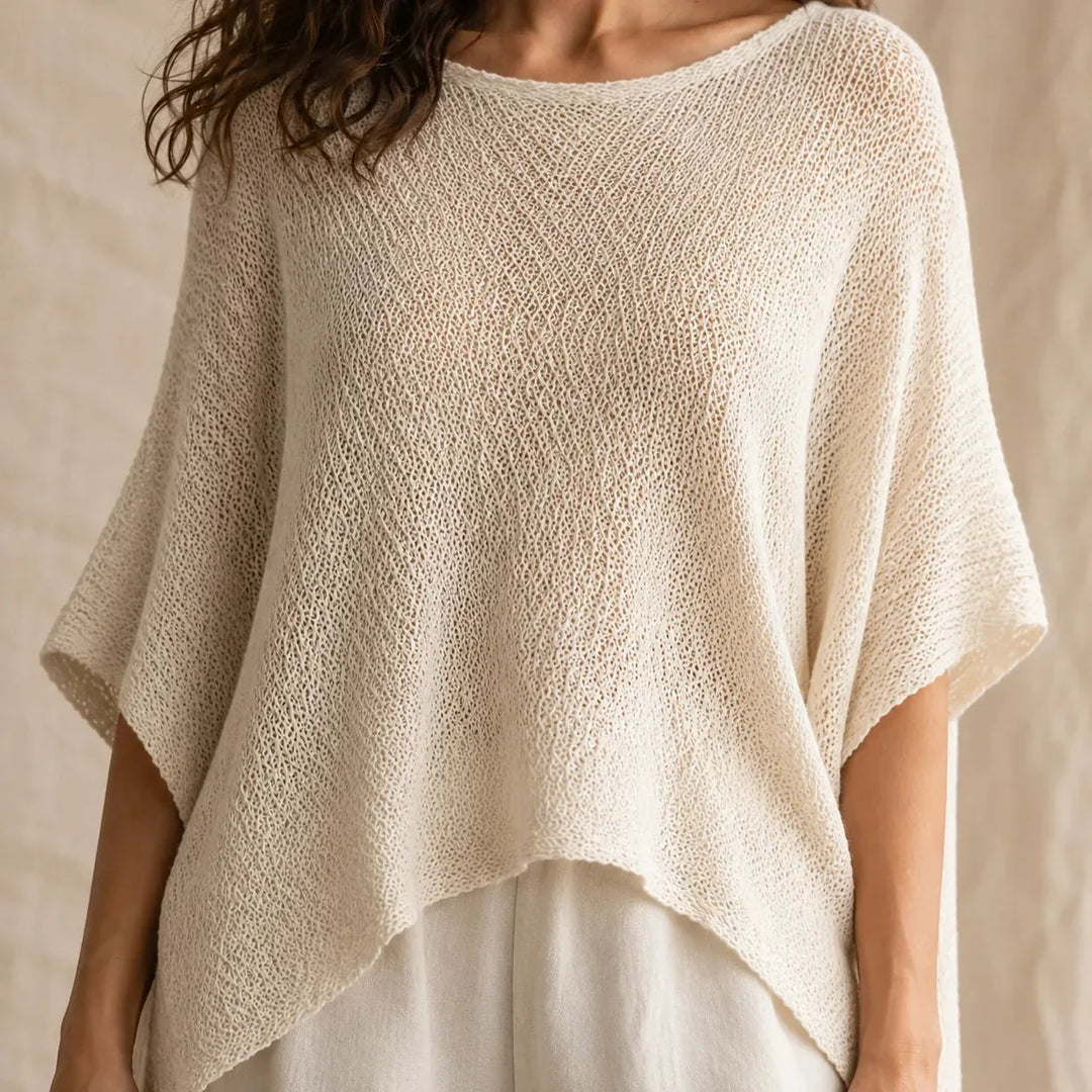 Solvera – Open Knit Batwing Top with Asymmetrical Hem