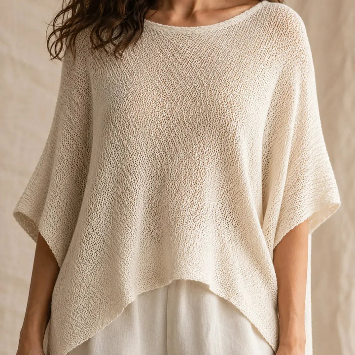 Solvera – Open Knit Batwing Top with Asymmetrical Hem
